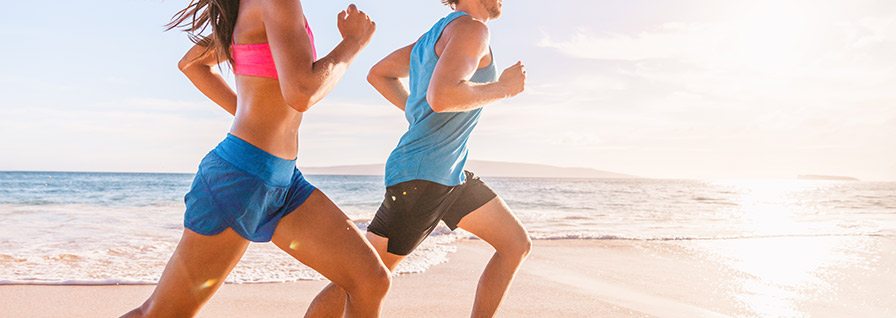  couple running on the beach