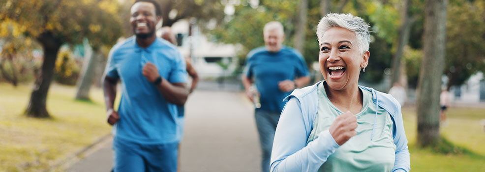 Happy people running outdoors
