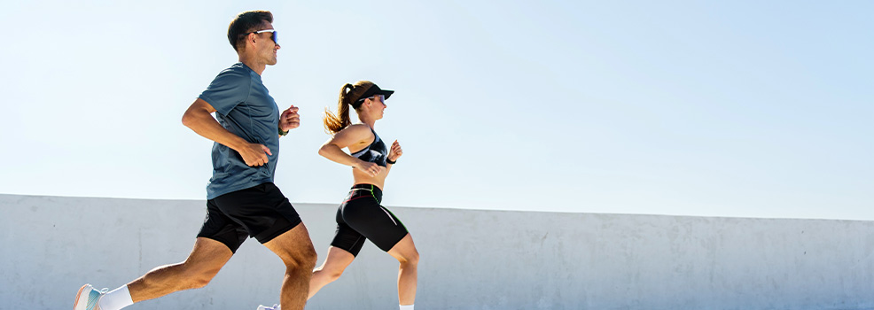 Man and woman running outdoors