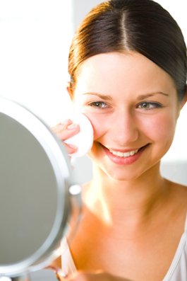 Woman cleaning face