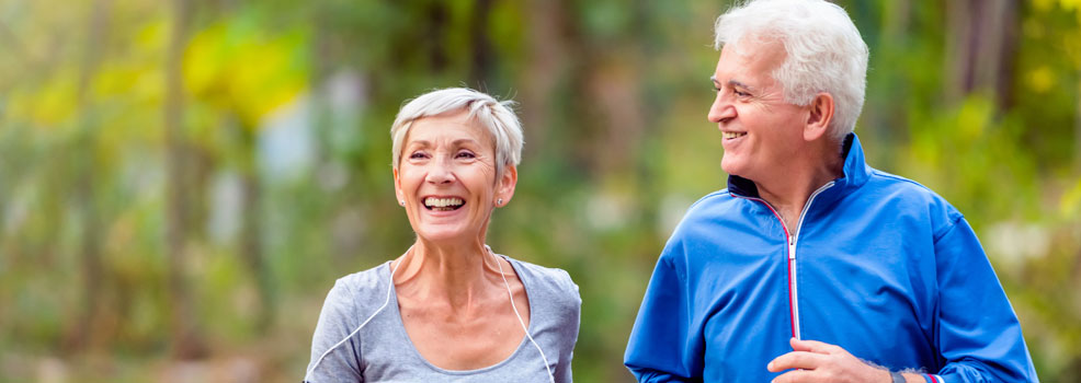 Senior couple jogging in the park