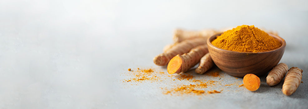 Wooden bowl turmeric powder