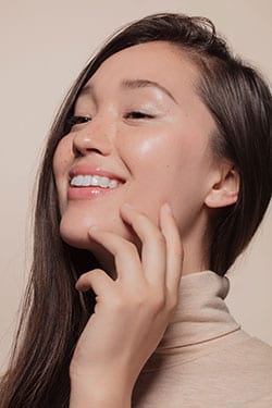 Woman maintaining healthy skin with keratin