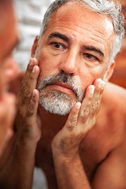 Man touching his face