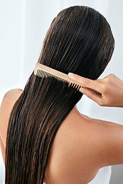 Woman combing her hair
