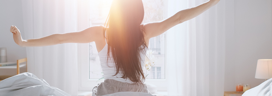 woman stretching in the sunshine