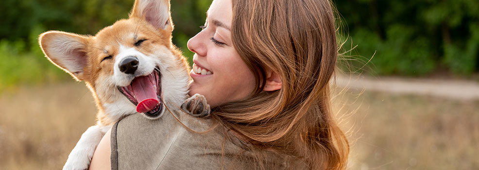 Woman with corgi