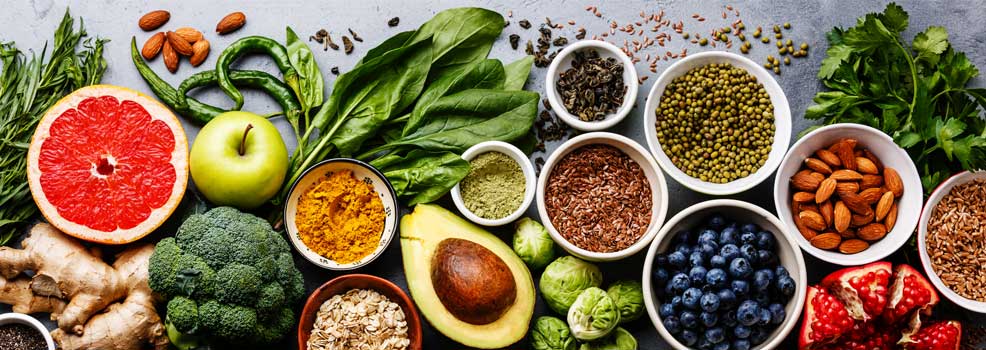 Selection of healthy foods such as fruits, vegetables and seeds