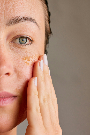 Woman applying skincare products